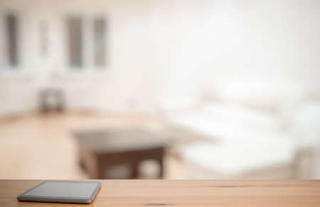 tablet on wooden table in the living roomの写真素材