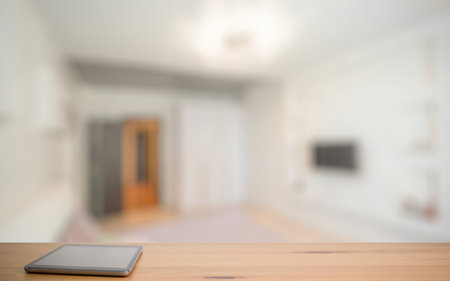 tablet on wooden table in the living roomの写真素材