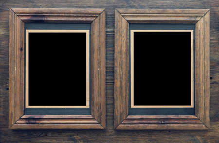 old frames on wooden wallの写真素材