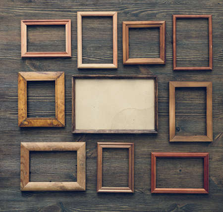 old frames on wooden wallの写真素材