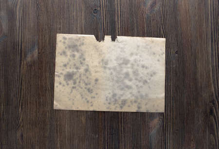 white paper on old wooden backgroundの写真素材