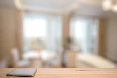 tablet on wooden table in the living roomの写真素材