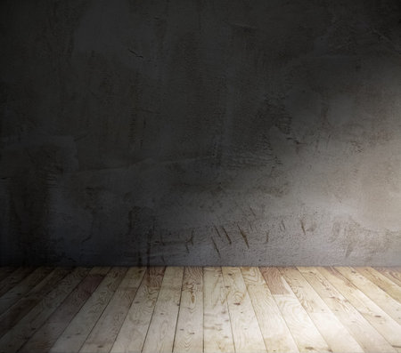 old room with concrete wall and wooden floor
