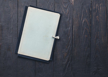 retro folder on old wooden background