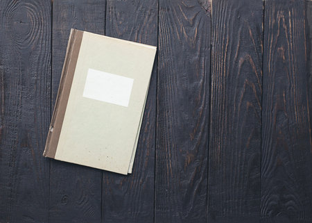 retro folder on old wooden backgroundの写真素材