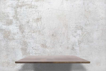 empty shelves on concrete wallの写真素材