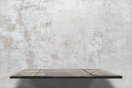 empty shelves on concrete wallの写真素材