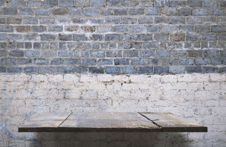 empty shelves on brick wallの写真素材