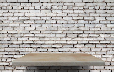 empty shelves on brick wallの写真素材