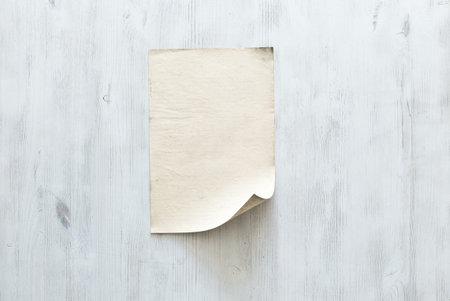 old paper on blue wooden wall, retro background