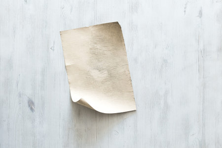 old paper on blue wooden wall, retro backgroundの写真素材