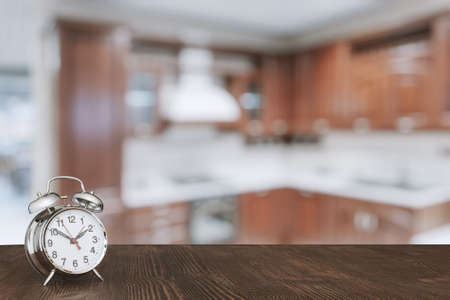 clock on wooden table in the kitchenの写真素材