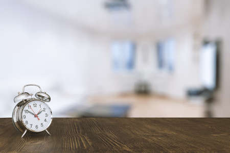 clock on wooden table in the living roomの写真素材
