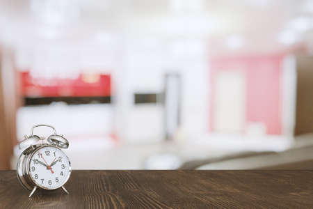 clock on wooden table in the living roomの写真素材