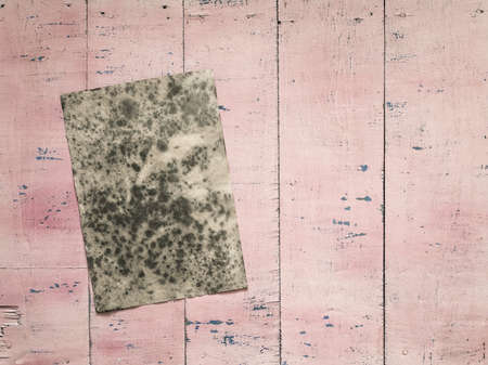 old paper on grunge pink wooden backgroundの写真素材