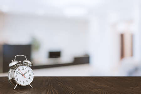 clock on wooden table in the living roomの写真素材
