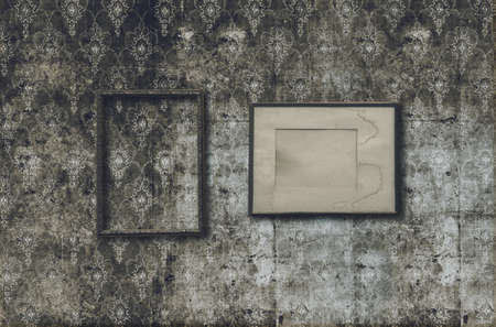 old photo frames on retro wallpaperの写真素材
