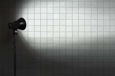 spot light on tile wallの写真素材