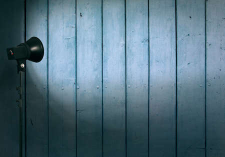 spot light on wooden wallの写真素材