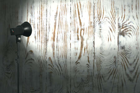 spot light on wooden wallの写真素材
