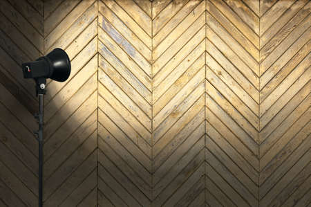 spot light on wooden wallの写真素材