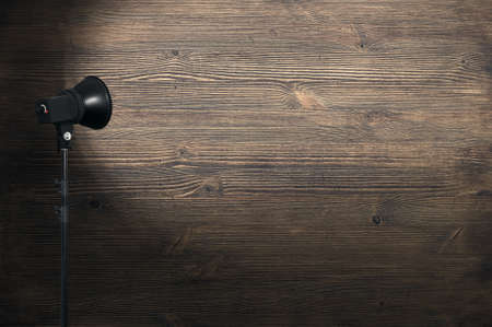 spot light on wooden wallの写真素材