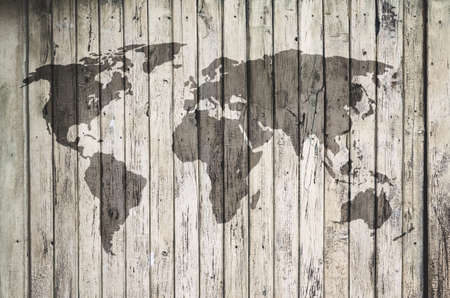 world map on old wooden wallの写真素材
