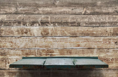 empty shelves on wooden wallの写真素材