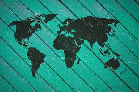 world map on old wooden wallの写真素材
