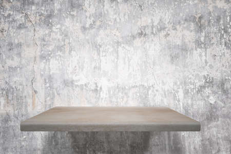 empty shelves on concrete wallの写真素材