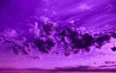 violet sky with clouds, neon dramatic backgroundの写真素材
