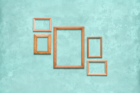 old wooden frames on blue wall