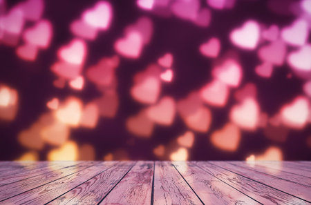 Empty wooden table over heart shape bokeh, bright Valentine's day background.