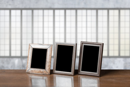 old photo frames on the wooden table in the living room