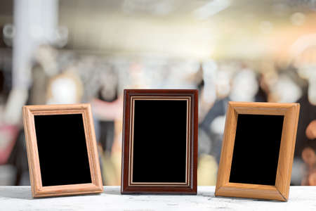 photo frames on the wooden table in the living roomの写真素材