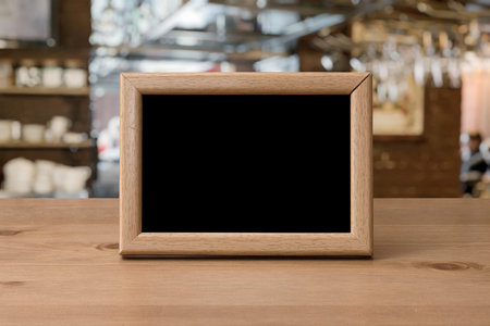 old photo frame on the wooden table in a night club