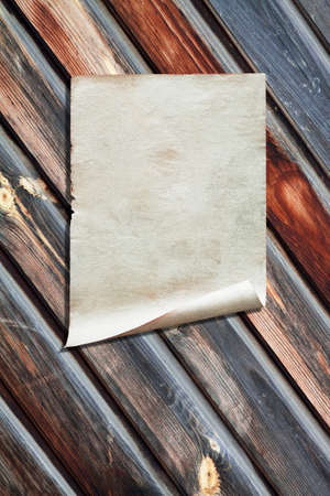 white paper on old wooden wall, background with copy spaceの写真素材