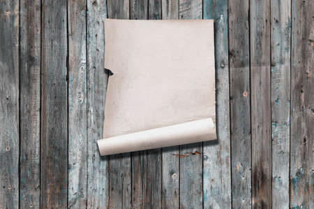white paper on old wooden wall, background with copy spaceの写真素材