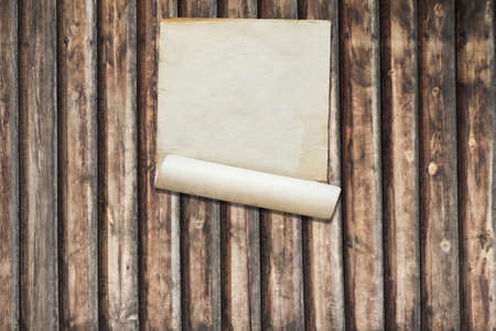 white paper on old wooden wall, background with copy spaceの写真素材