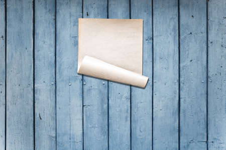 white paper on old wooden wall, background with copy spaceの写真素材