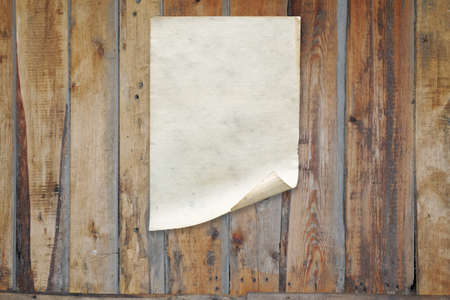 white paper on old wooden wall, background with copy spaceの写真素材