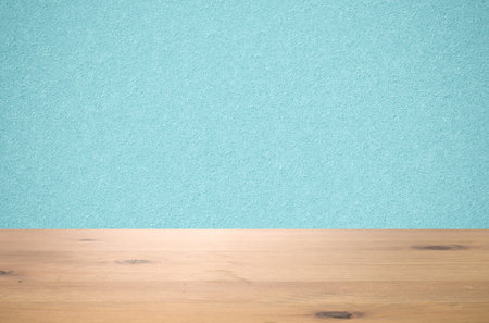 Studio table background with blue wall