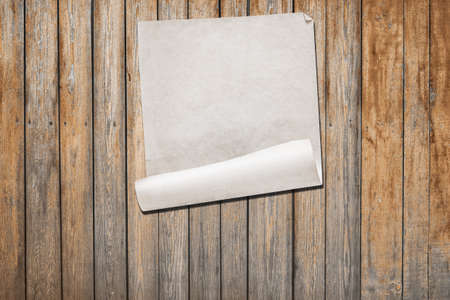 white paper on old wooden wall, background with copy spaceの写真素材