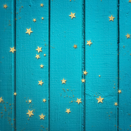 golden confetti on blue wooden background