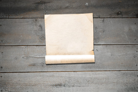 white paper on old wooden wall, background with copy spaceの写真素材