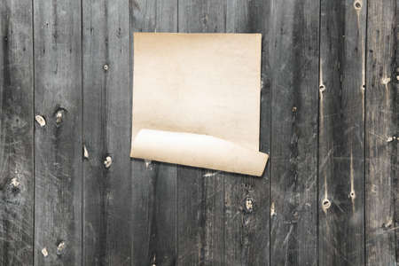 white paper on old wooden wall, background with copy spaceの写真素材