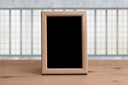 old photo frame on the wooden table in the living roomの写真素材