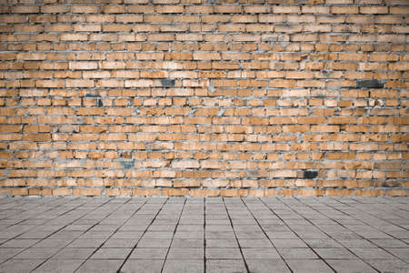 Empty room with bricks wall and tiled floor. Interior background.の写真素材