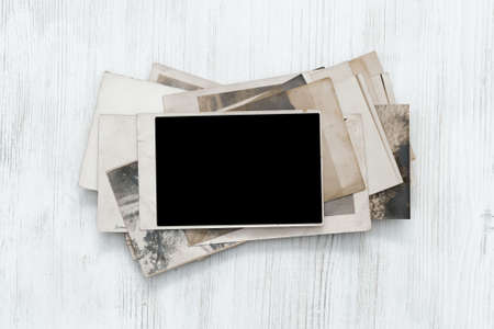 old retro photos on table, vintage backgroundの写真素材