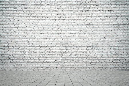Empty room with bricks wall and tiled floor. Interior background.の写真素材